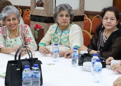Group of senior women in traditional attire enjoying Raksha Bandhan celebration by Gandhi Seva Loka in Jakarta.